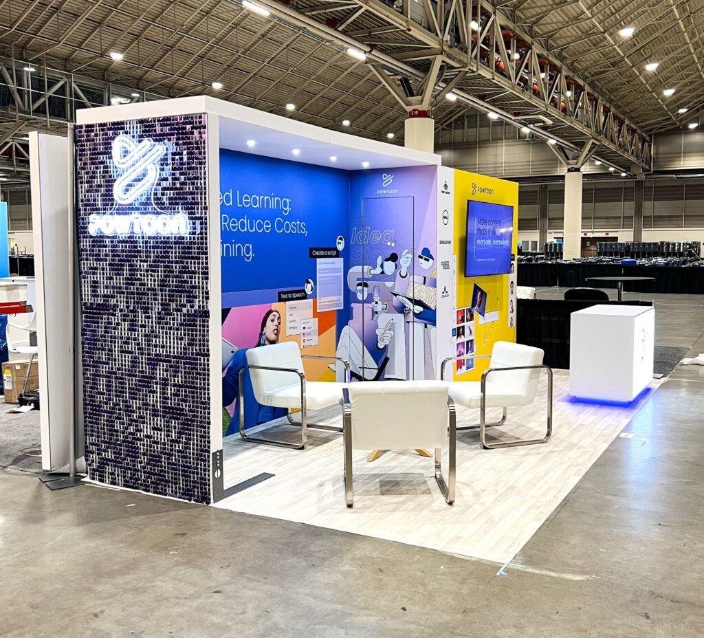 Modern trade show booth with vibrant branding and seating area designed by 3tree Marketing for national event exposure.